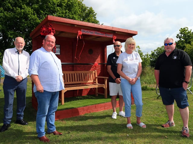 Fleetlands club officials (from left) Mark Hook, Iain Sellstrom (chairman), Kevin Wrapson, Jackie Wrapson and Andy Burdon at a new bench honouring the memory of former club president George Mason.
Picture: Chris Moorhouse