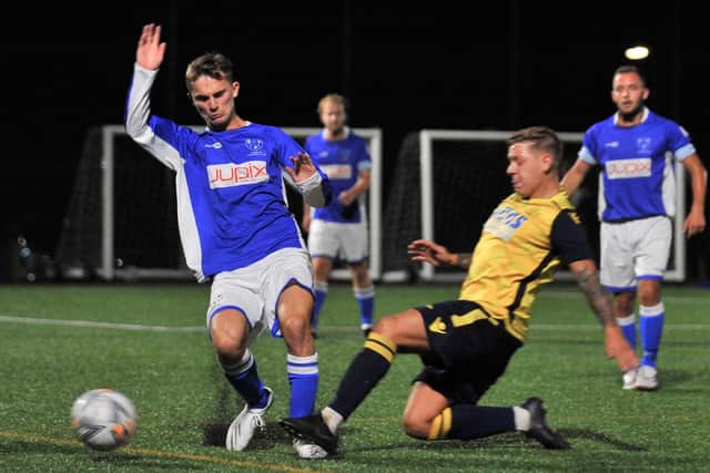 Moneyfields' Jake Raine, right, goes in for a tackle during his side's 4-0 Portsmouth Senior Cup win against Denmead. Pic: Martyn White.