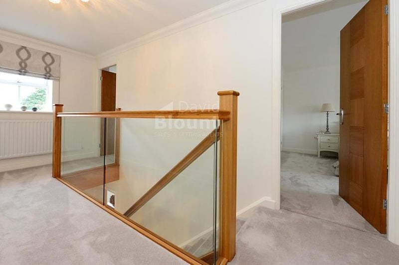 This galleried landing is an unexpected asset at the Mayflower Court property. One cupboard houses the hot-water cylinder, while another is for storage. There is also access to the loft.