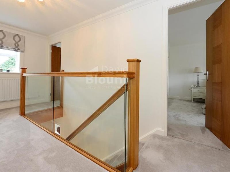 This galleried landing is an unexpected asset at the Mayflower Court property. One cupboard houses the hot-water cylinder, while another is for storage. There is also access to the loft.