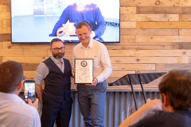 Simon Ingram, Mountjoy accepts a commemorative plaque on behalf of all the businesses that made The Forge possible.