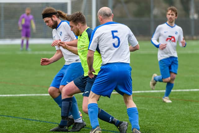 Luke Musselwhite (green shirt) in action for Harvest Home against West Wight Reserves in the Hampshire Vase.  Picture: Vernon Nash