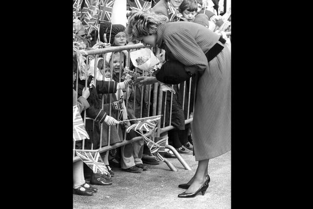Diana meeting the people during her visit to the city in April 1986. The News PP181