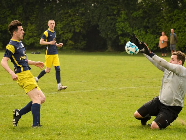 Action from Saturn Royale's 1-0 win over Pelham Arms (blue and yellow kit) in the second Adelaide Cup semi-final. Picture: Keith Woodland (300421-495)