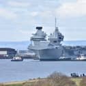 HMS Queen Elizabeth has returned to the dockyard in Rosyth, Fife, Scotland, for repairs. She left Portsmouth in March after a fault was found to her starboard propeller shaft coupling in February.  (Pic: Mark Berry)