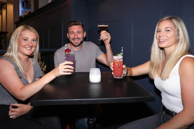 From left, Katie and Liam Perkins, and Alice Hosker. The Monarch in Palmerston Rd, Southsea, reopened on 'Super Saturday' following the easing of Covid-19 restrictionsPicture: Chris Moorhouse    (040720-13)