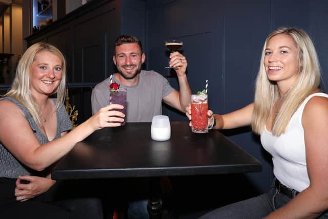 From left, Katie and Liam Perkins, and Alice Hosker. The Monarch in Palmerston Rd, Southsea, reopened on 'Super Saturday' following the easing of Covid-19 restrictions
Picture: Chris Moorhouse    (040720-13)
