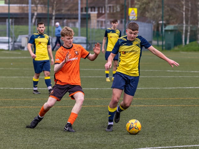 Action from the 2-2 draw between the under-18s of Moneyfields (blue/yellow kit) and AFC Portchester (orange/black kit). Picture: Mike Cooter