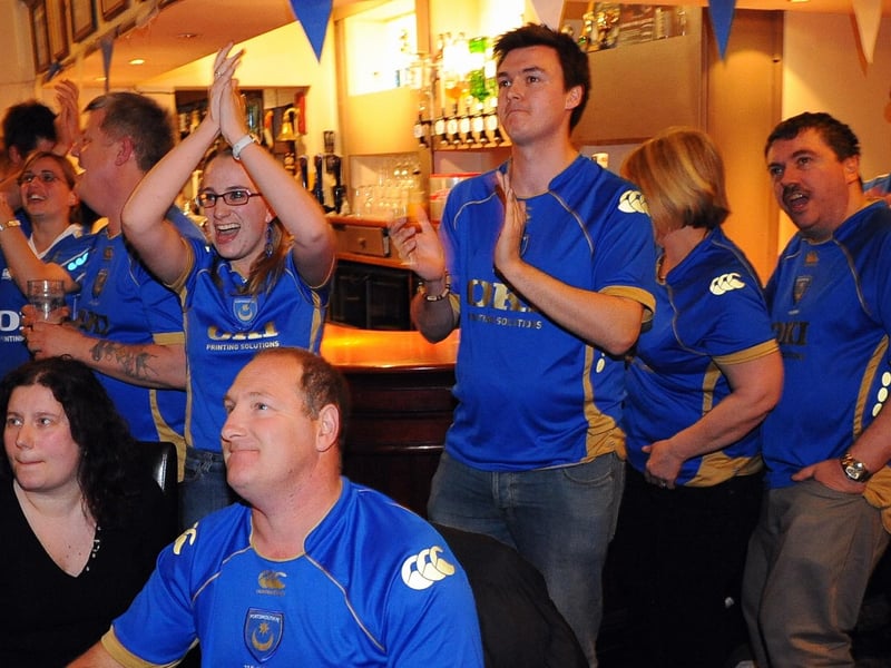 These Pompey fans are glued to the TV for Pompey's Premier League trip to Newcastle in April 2009.