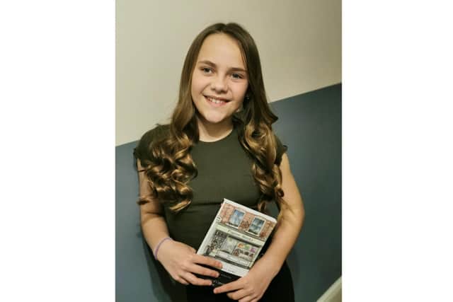 Isabelle Walsh-Deakins with her copy of The Adventures of Captain Rogers. Picture: Leanne Deakins