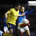 Marcus Harness successfully battles for possession with Arsenal's Sokratis Papastathopoulos in last night's 2-0 FA Cup defeat. Picture: Joe Pepler