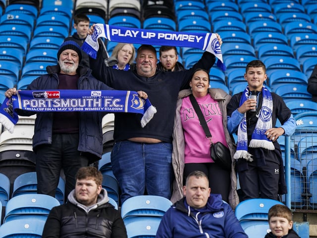 Made it! These Pompey fans look happy after finally arriving at Brunton Park after an early start.