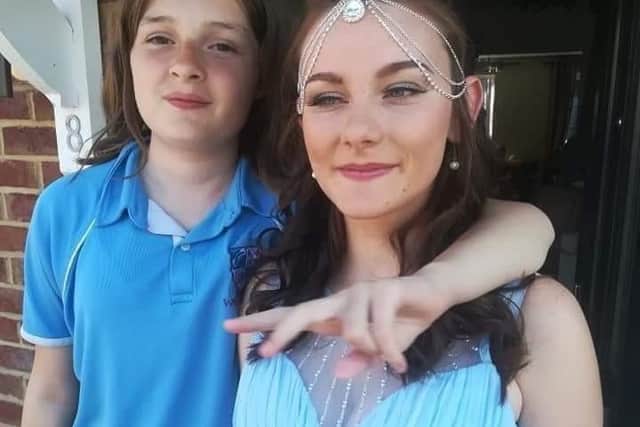 Louise Smith wearing the headdress before her school prom when she was 16, with Arleah next to her. Picture: Hannah Welstead.