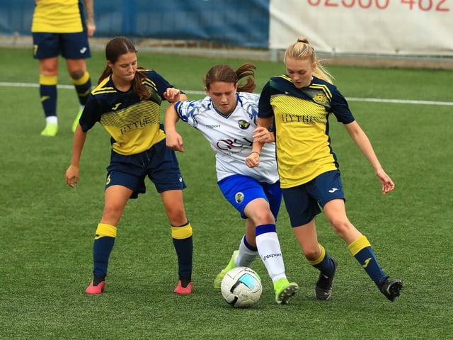 Hawks' Chloe Marsh with Moneys pair Jocie Dunmore and Farrah Thompson. Picture by Dave Haines