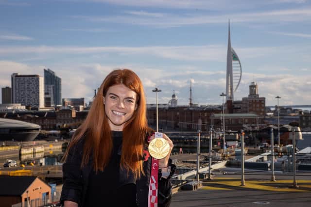 Lauren Steadman pictured on HMS Prince of Wales in front of the Spinnaker Tower with her gold medal from the Tokyo 2020 games. Photos by Alex Shute