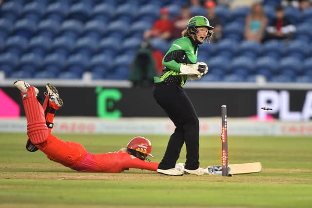 Welsh Fire's Georgia Redmayne is run out by Carla Rudd of Southern Brave. Photo by Nathan Stirk/Getty Images.