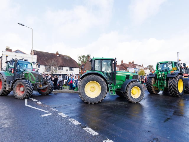Crowds gathered in Wickham Square to watch the procession of tractors go by all to raise money for Rowans Hospice and Guide Dogs.
