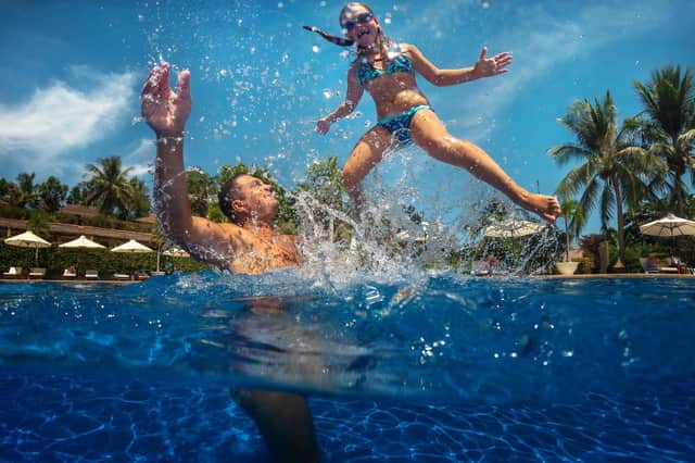 DUNK-A-DAD: Blaise has always loved taking his children swimming Picture: Shutterstock