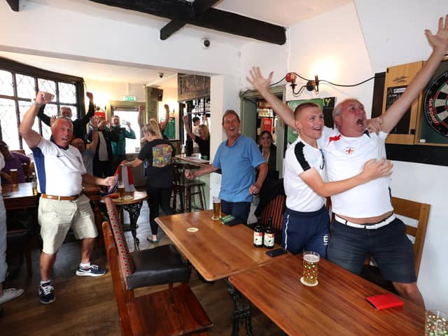 Fans celebrate as England turn the game on its head late on against Slovakia.Picture: Sam Stephenson.