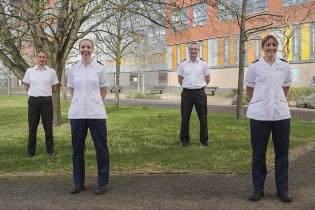 The navy medics working at QA. Pictured left to right are: Commander Alastair Witt, Leading Naval Nurse Sarah Belcher, Surgeon Captain Barrie Dekker and Lieutenant Amy Phelps,  outside Queen Alexandra Hospital in Portsmouth. Photo: LPhot Belinda Atker
