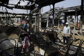 A burnt out bus on the streets of Lagos, Nigeria, following days of unrest in which the army are accused of opening fire on civilians.

AP Photo/Sunday Alamb