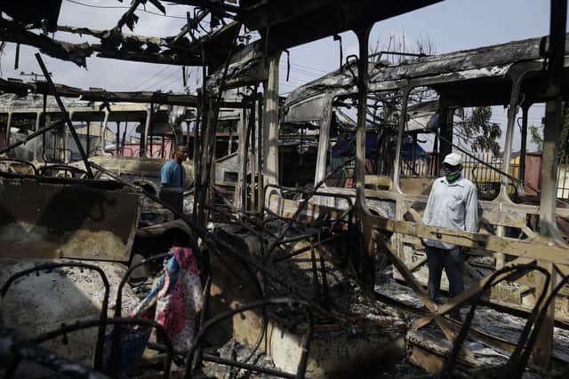 A burnt out bus on the streets of Lagos, Nigeria, following days of unrest in which the army are accused of opening fire on civilians.
AP Photo/Sunday Alamb