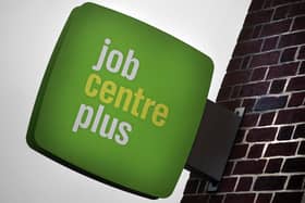 The Jobcentre Plus logo is seen displayed outside the employment office on January 18, 2012. Photo by Matt Cardy/Getty Images