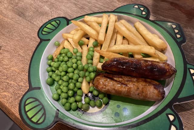 The children's meal of sausage, chips and peas at Wildwood in Whiteley