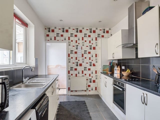 The kitchen is a large and contemporary space.
