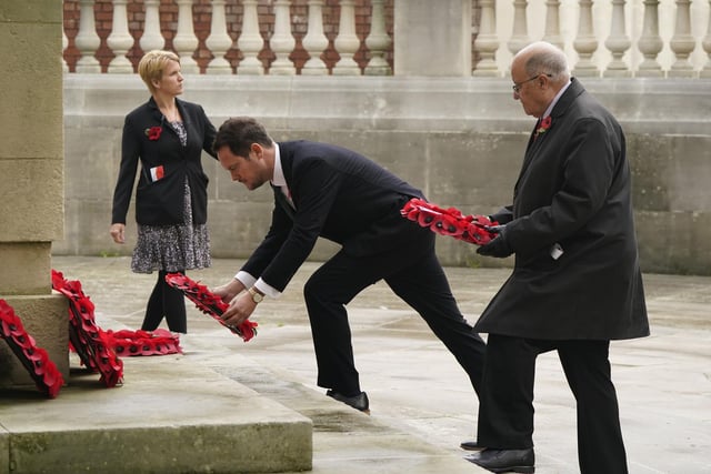 Stephen Morgan (centre), Labour MP for Portsmouth South, lays a wreath at the City of Portsmouth War Memorial