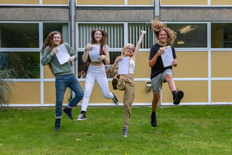 Jumping for joy at Crookhorn College on GCSE results day. Pictured Xander King, Siobhan Waddon, Ellie Bryant and Oscar Jannece. Picture: Mike Cooter (240823)