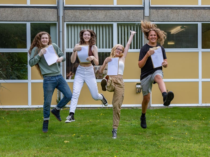 Jumping for joy at Crookhorn College on GCSE results day. Pictured Xander King, Siobhan Waddon, Ellie Bryant and Oscar Jannece. Picture: Mike Cooter (240823)