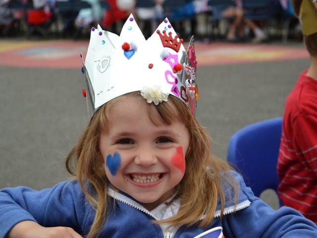 Pupils enjoying a Platinum Jubilee street party in the playground of Devonshire Infant School, Southsea