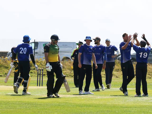 Portsmouth celebrate the wicket of Sarisbury's Matt Journeaux during their Southern Premier League win at St Helens. Picture by Sam Stephenson