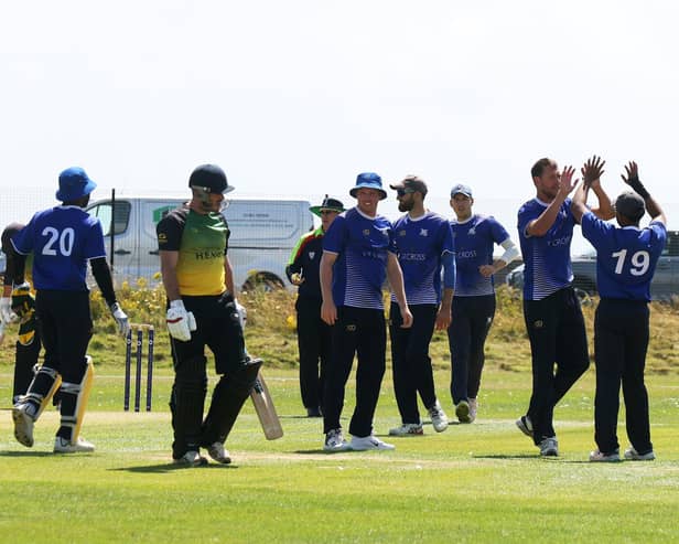 Portsmouth celebrate the wicket of Sarisbury's Matt Journeaux during their Southern Premier League win at St Helens. Picture by Sam Stephenson