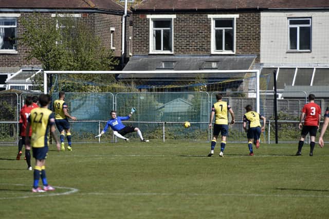 Steve Hutchings scores his first penalty in Moneyfields' Portsmouth Senior Cup semi-final win against Fareham. Picture: Allan Hutchings