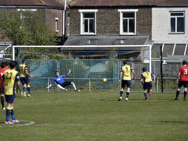 Steve Hutchings scores his first penalty in Moneyfields' Portsmouth Senior Cup semi-final win against Fareham. Picture: Allan Hutchings