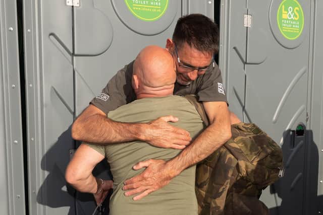 Pictured is: Ian Baillie is hugged by Mike Hewitt,

Picture: Keith Woodland (190921-95)