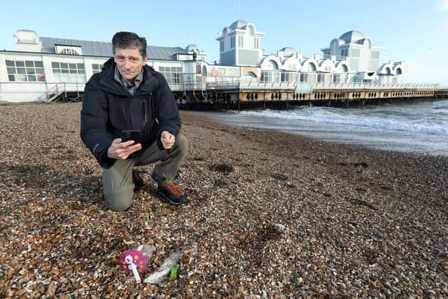 Steve Bomford photographs plastic waste on Southsea beach using the Jetsam app 
Picture: Chris Moorhouse     (150120-18)