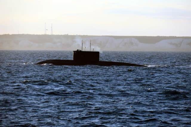 A surfaced Algerian submarine passes the Kent coast while being monitored by HMS Severn. Photo: Royal Navy
