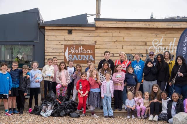 Boundary Oak School students and staff, and the rubbish they collected outside Southsea Beach Café.
