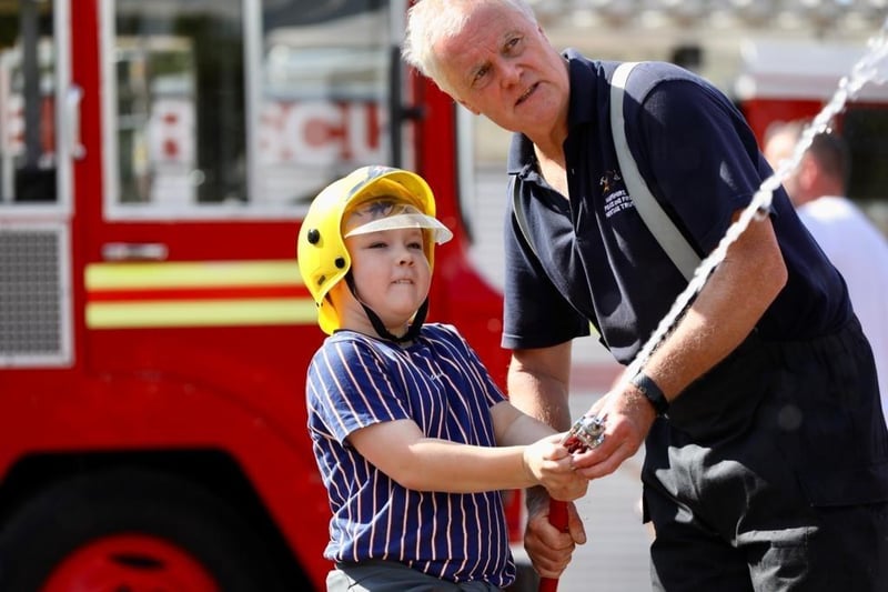 Harry Pickard, 10, on the firehose.
