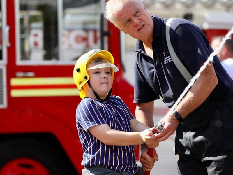 Harry Pickard, 10, on the firehose.