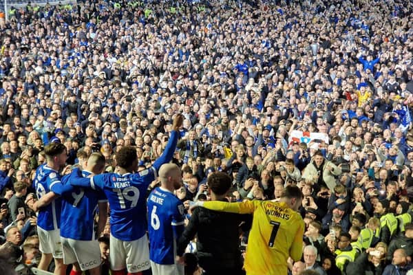 Pompey players celebrate with fans at Fratton Park