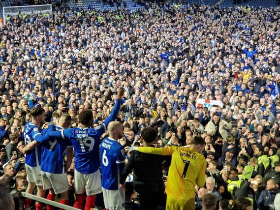 Pompey players celebrate with fans at Fratton Park
