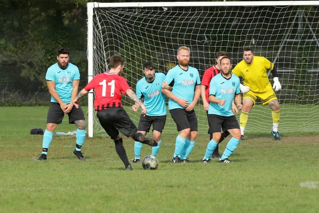 North End Lions prepare to defend an AFC Fairfields free-kick. Picture: Kevin Shipp.