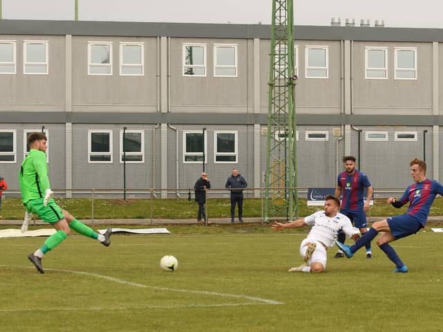 James Franklyn fires US Portsmouth into the lead against Binfield. Picture: Keith Woodland