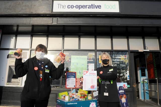 The Co-op in The Square, Wickham, started their reverse advent calendar on Tuesday, December 1, asking for donations for Meon Valley Food Bank.
Pictured is: Customer service assistants Jackie Mitchell and Andrea Davanna.
Picture: Sarah Standing (011220-9192)