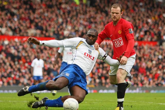 Sol Campbell clears the ball under pressure from Wayne Rooney. Picture: Richard Heathcote/Getty Images
