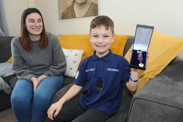 Adam Newman (5) from Gosport, has recently been awarded the Little Troopers of the month award.

Pictured is: Adam Newman (5) with his mum Lauren Newman (25).

Picture: Sarah Standing (040322-307)